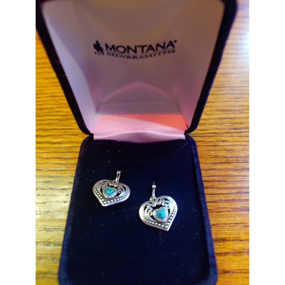 the Montana Silversmiths Fierce Hearts Earrings displayed in a branded box. [1]